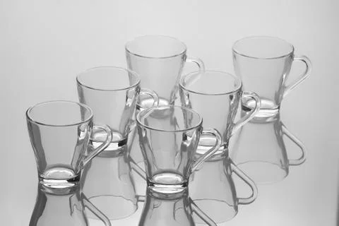 Set of six empty cup of tea with handle isolated on white blurred background Stock-Fotos