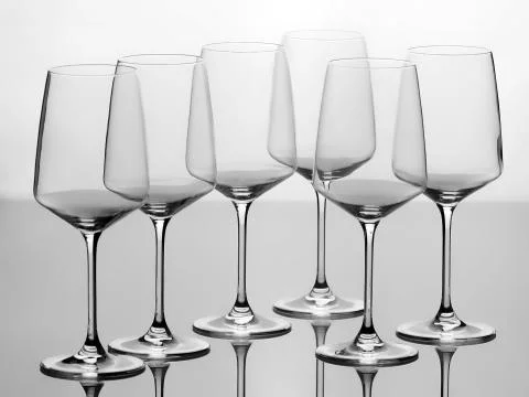 Set of six empty wine glasses, isolated on white background Stock Photos