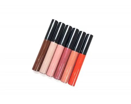 A set of six lipsticks in different red, beige, brown, peach, pink, plum shad Stock Photos