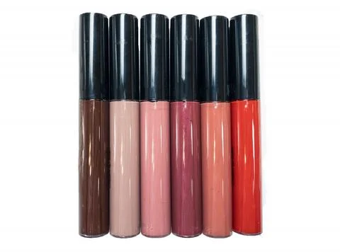 A set of six lipsticks in different red, beige, brown, peach, pink, plum shad Stock Photos