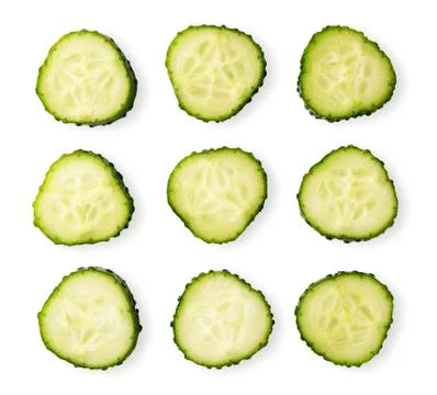 A set of slices of cucumber top view. Isolated on a white Stock Photos