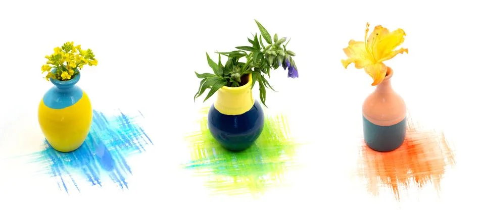 A set of small cute tiny vase with mini flowers bouquet and hand painted wate Stock Photos