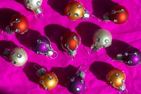 Set of small round multicolored red, orange, white balls for decoration a Stock Photos