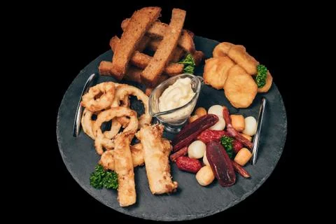 Set of snacks for beer from crackers, onion rings, sausage and cheese Stock Photos