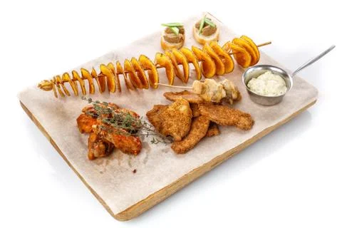Set snacks to beer. Potato chips, chicken wings, basturma, cheese and chicken Stock Photos