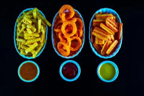 Set of snacks with various dips, crispy snacks in bowls, good food Stock Photos