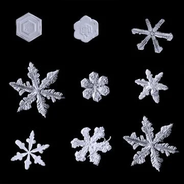 Set of snowflakes isolated on black background Stock Photos