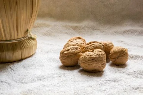 Set with some walnuts and a wine bottle Stock Photos