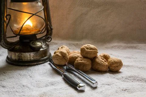 Set with some walnuts, a nutcracker and a lantern Stock-Fotos
