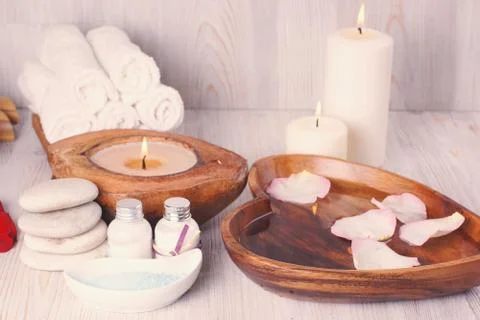 Set for spa procedures on the table, white color, gentle atmosphere Stock Photos