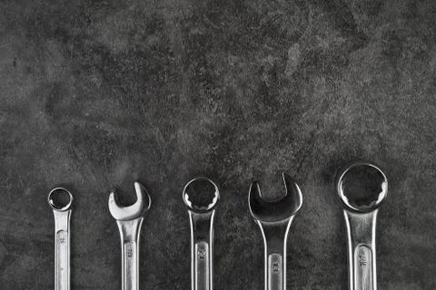 Set of spanner on old abandoned iron plate Stock Photos
