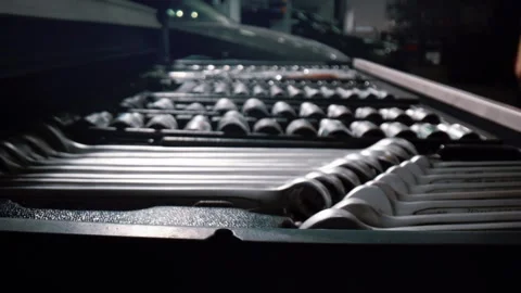 Set of spanners of various sizes in a pull-out drawer at a car repair workshop 库存影片 340580964