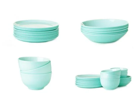 Set of stacked mint ceramic plates isolated on white background. Stock Photos