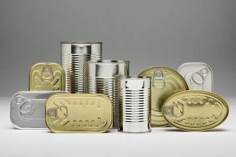Set of stacked unopened cans Stock Photos