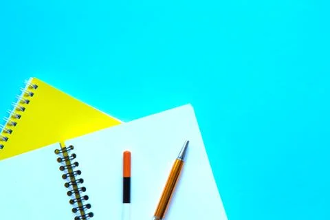 Set of stationery on blue background. Flat lay Stock Photos