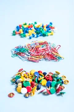 A set of stationery made of multi-colored buttons and paper clips in differen Stock Photos