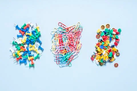 A set of stationery made of multi-colored buttons and paper clips in differen Stock Photos