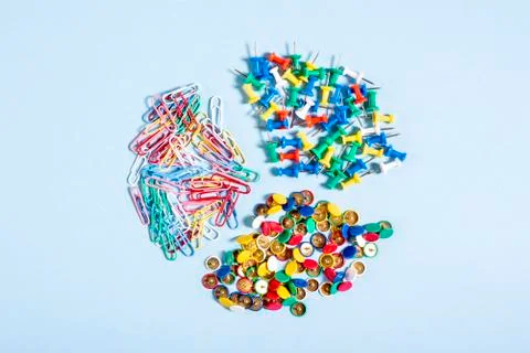 A set of stationery made of multi-colored buttons and paper clips in differen Stock Photos