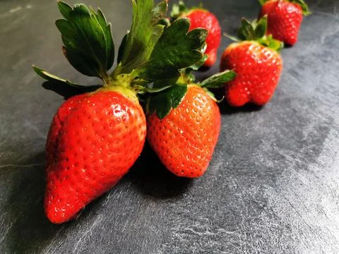 Set of strawberries on the kitchen bench Stock Photos