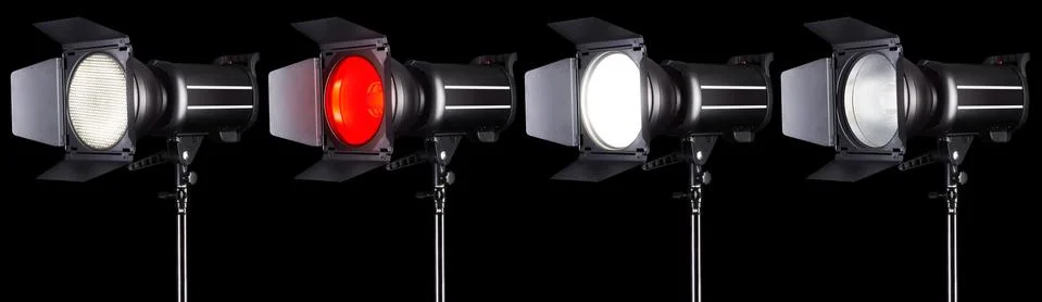 Set of studio flash lights isolated on black background with lamp. Stock Photos