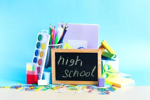 A set of subjects for study and creativity and the inscription "High school" Stock Photos