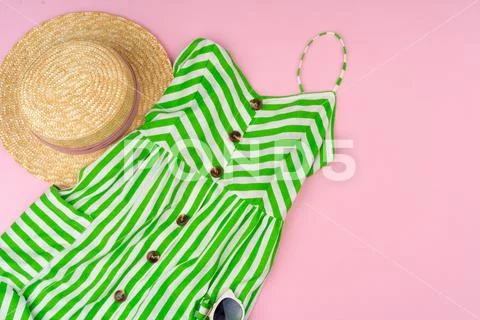 Set of summer clothes for woman on pink background Stock Photos
