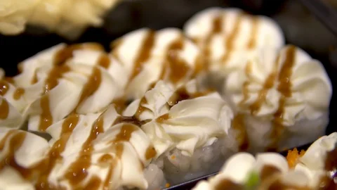 Set of sushi and rolls close-up. The camera moves away. Sushi and rolls Stock Footage 128704347