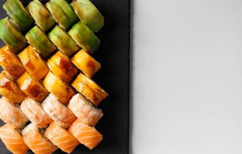 Set of sushi rolls in plastic packages on a white background, top view. Foto stock