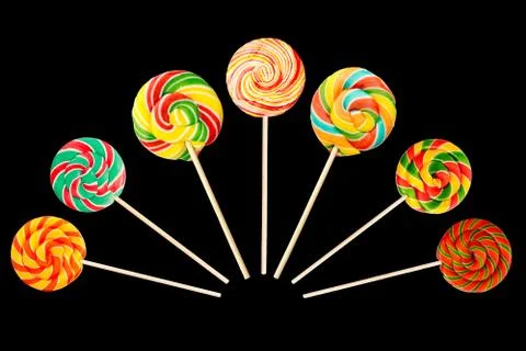 Set of sweet lollipop round shape isolated on black background for decorating Stock Photos