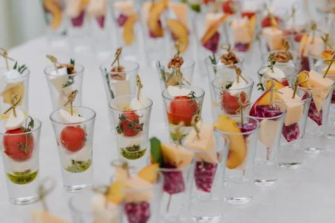 A set table with appetizers arranged in a row Stock Photos