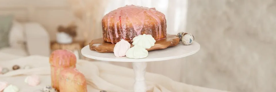 A set table for the celebration of Easter. Cakes and quail eggs on the Easter Stock Photos