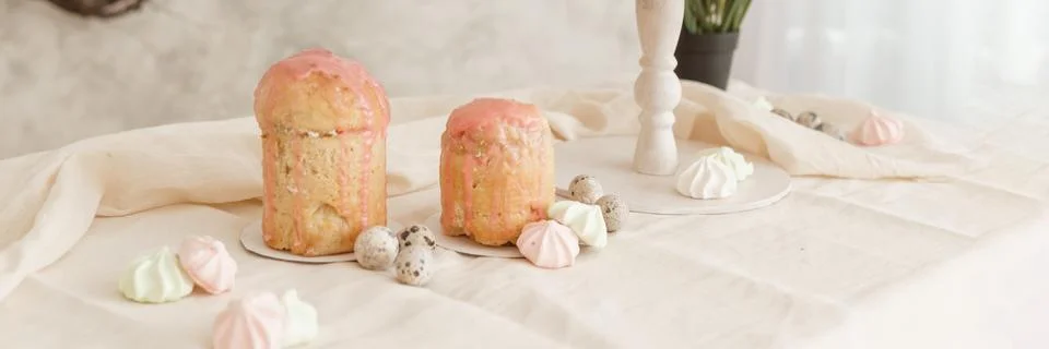 A set table for the celebration of Easter. Cakes and quail eggs on the Easter Stock Photos