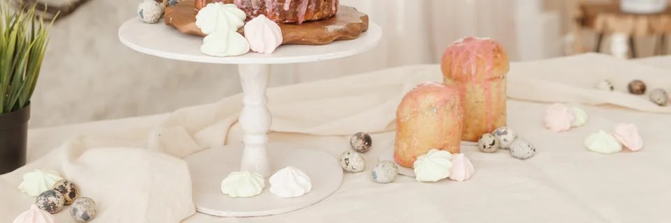 A set table for the celebration of Easter. Cakes and quail eggs on the Easter Stock Photos