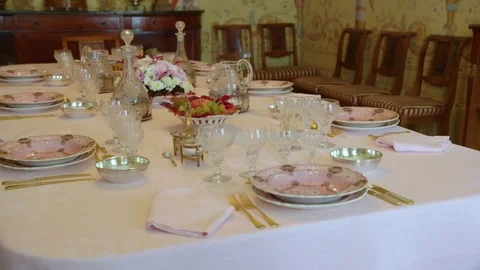 Set table with ceramic plates and crystal glasses Stock Footage 71943557