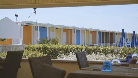 Set table with colorful cabins in the background Stock Footage 86203258