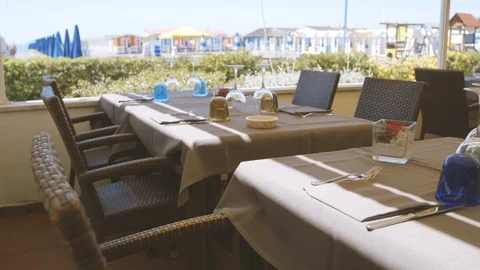 Set table with colorful cabins in the background Stock Footage 86203270