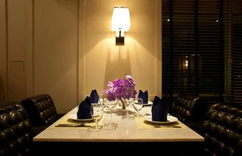 The set of table for dinner with leather chair Stock Photos