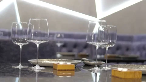 At a set table in an elite restaurant, empty wine glasses. Stock Footage 167242210