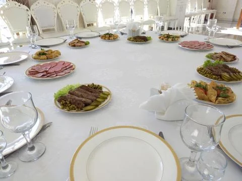 A set table in the hall of a restaurant Stock Photos