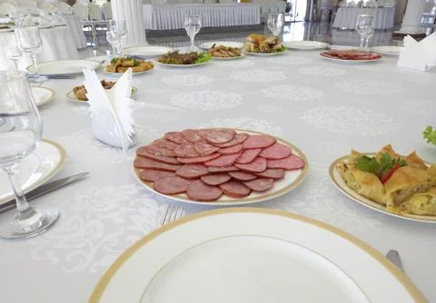 A set table in the hall of a restaurant Stock Photos