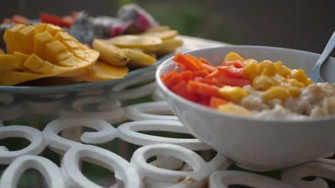 Set the table in the morning, put plates of porridge. 4k, 3840x2160. HD Stock Footage 138953544