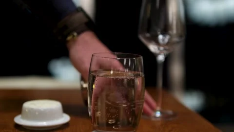 Set the table at night adjust the oil glasses on the table Stock Footage 303856985