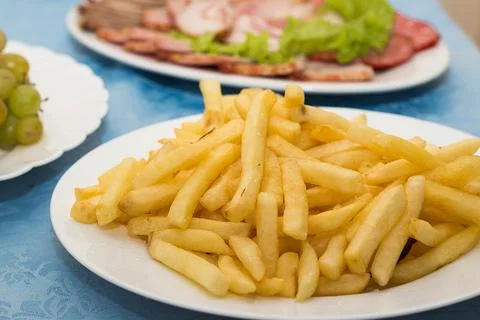 Set the table in the restaurant, different dishes on a blue tablecloth Stock Photos