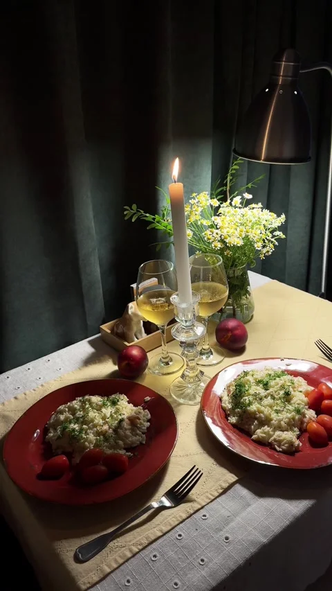 Set table with a tablecloth, dinner, a candle in a glass candlestick Stock Footage 342608728