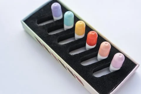 A set of tablets, vitamins in capsules lying in a special box Foto stock