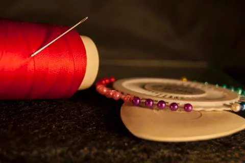 Set tailor: red thread with a needle, white chalk for drawing Stock Photos