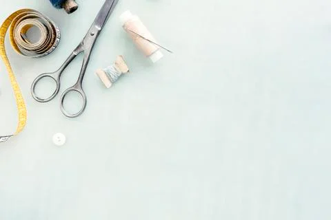Set of tailoring tools and accessories on table, top view Photos