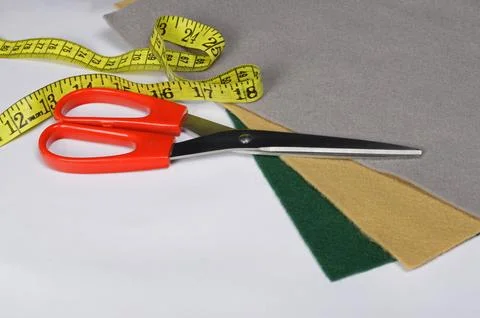 Set of tailoring tools, scissors and measuring tape, accessories and fabric Stock Photos
