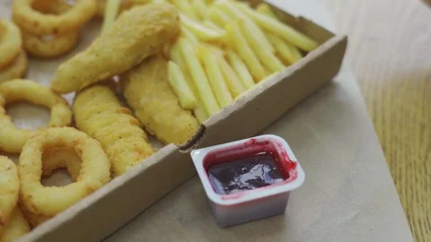 Set of takeaway paper boxes with different fast food, french fries, nuggets Stock Footage 278259350