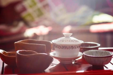Set of teapot, three kinds of tea and two bowls Fotos Stock